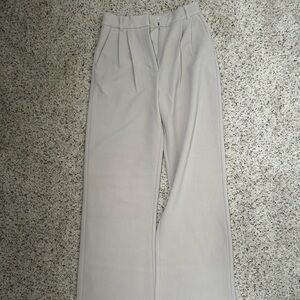 Beige pleated pants